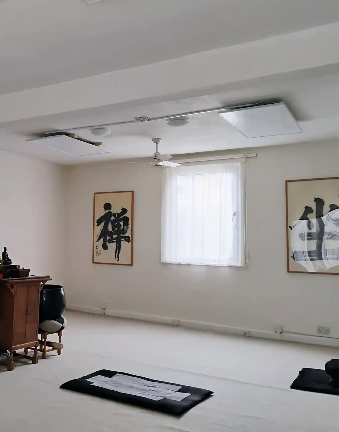 Minimalist room design featuring Kiasa infrared panel heater for cozy atmosphere