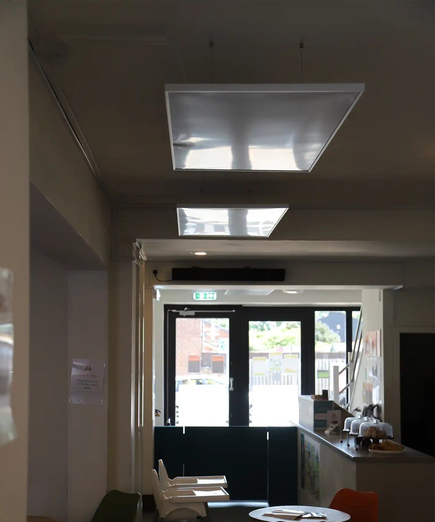 KIASA infrared heating panels suspended from the ceiling in the reception area of Little Foxes Play Town, providing discreet and efficient warmth.