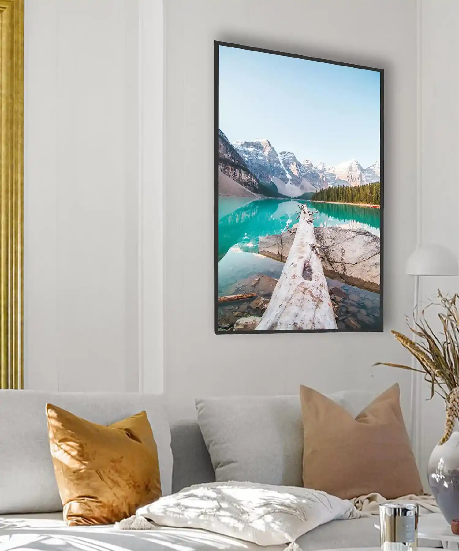 Framed infrared picture heater featuring a tranquil lake and golden-hour mountains, mounted in a modern living space with warm lighting