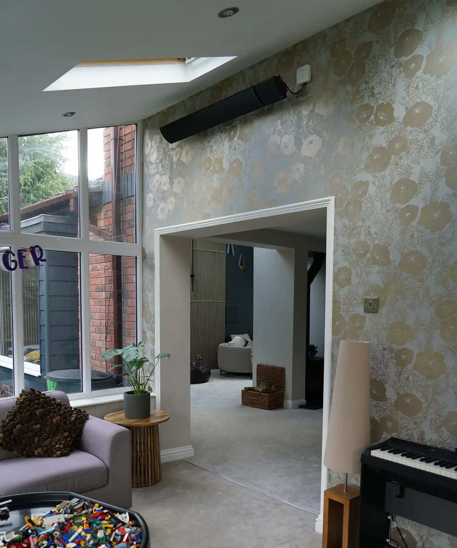 Contemporary living room with Kiasa infrared wall panel heater providing gentle warmth