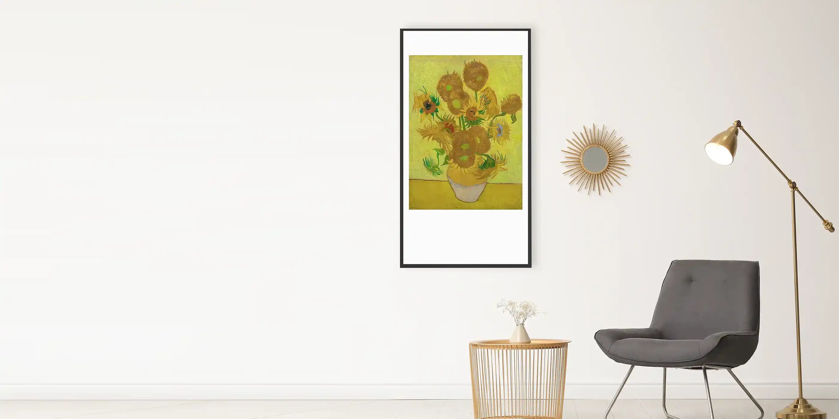Van Gogh sunflower print infrared picture heater mounted on a living room wall next to a gold floor lamp, grey armchair, and decorative mirror.