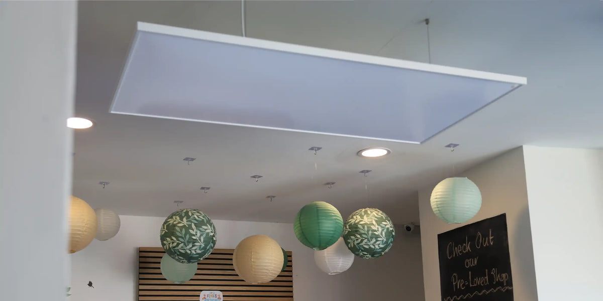 Suspended infrared heating panel delivering even heat distribution in modern open interior space