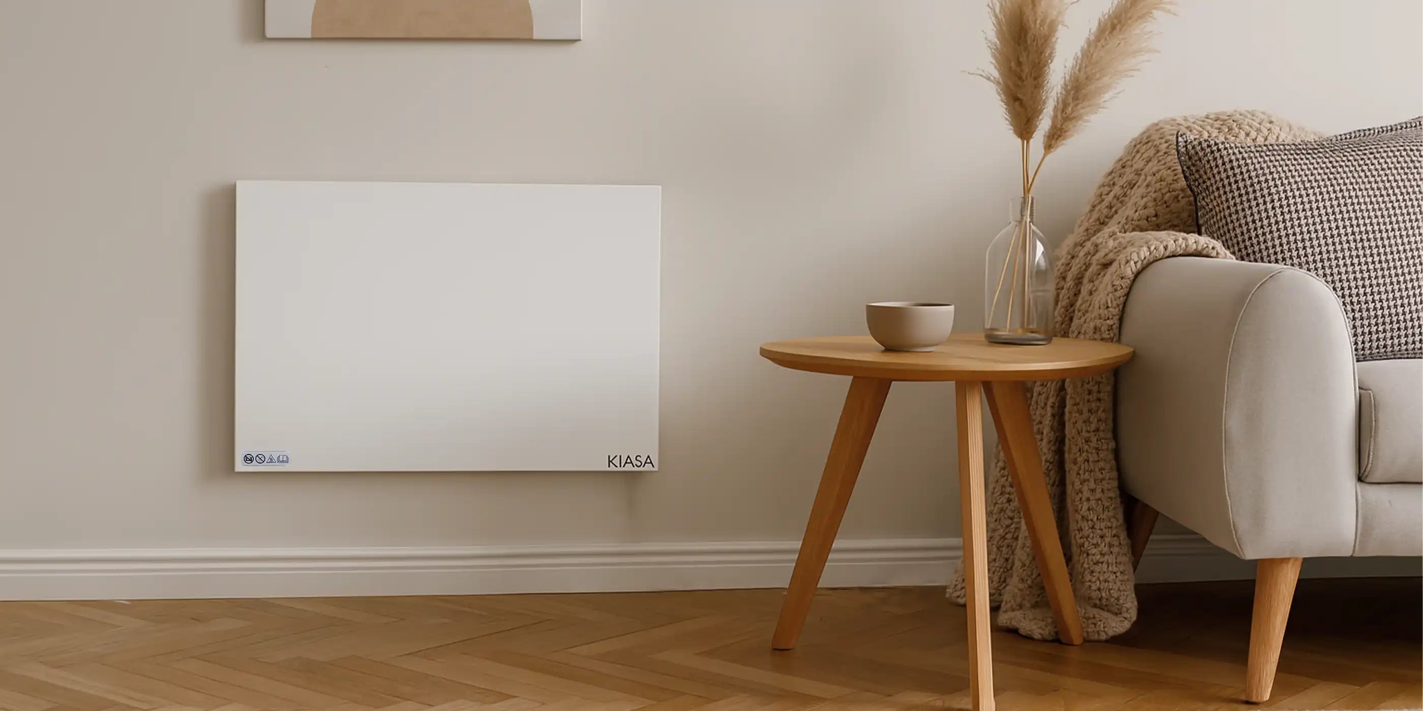 Kiasa Kore Hybrid Heater in a cosy, neutral-toned living room with a side table and pampas grass décor