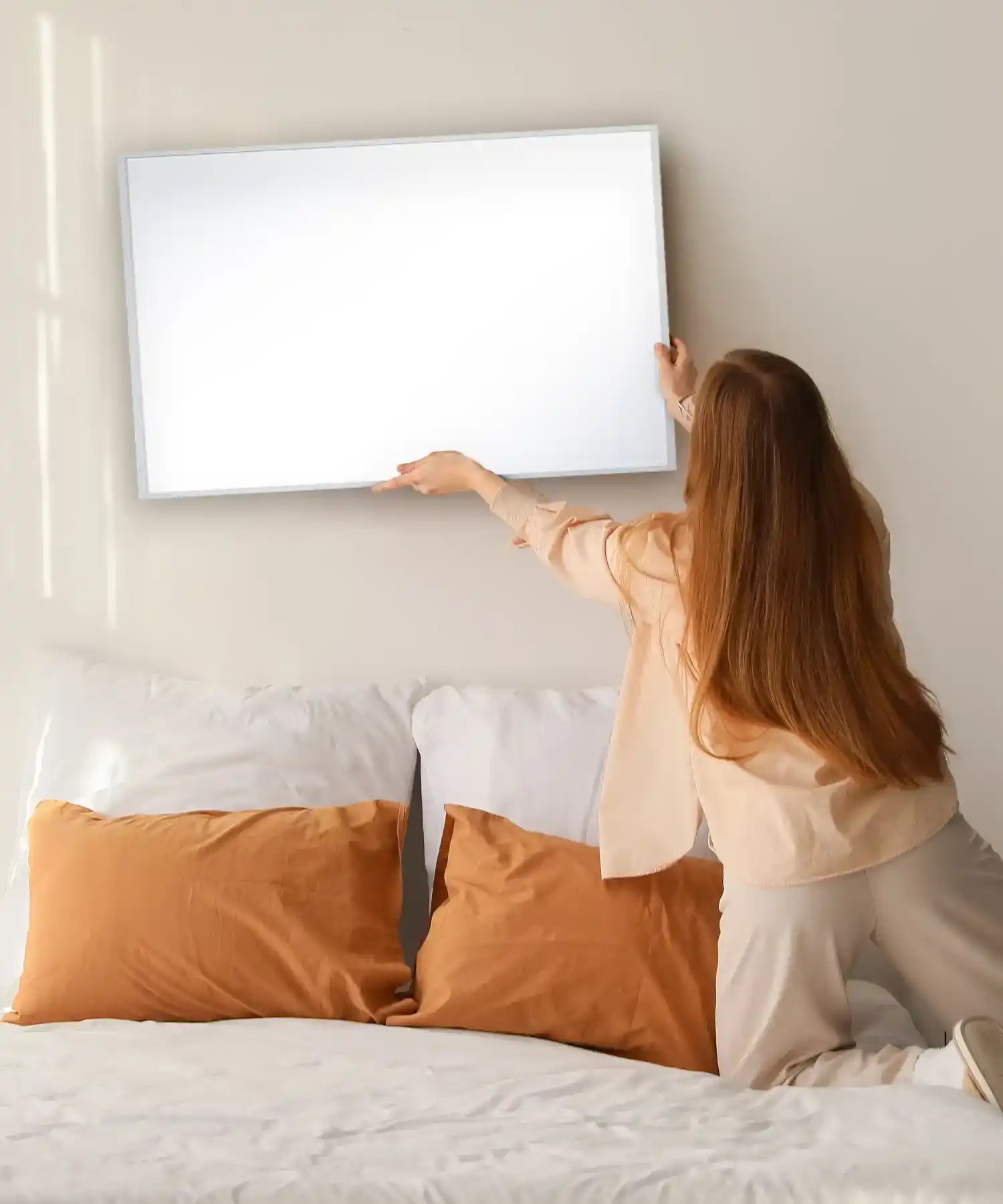 Lady installing the smart 450w panel on the bedroom wall