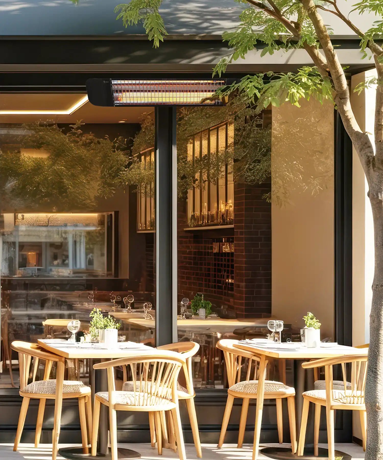Close view of restaurant terrace seating with wall mounted infrared patio heater above outdoor dining tables.