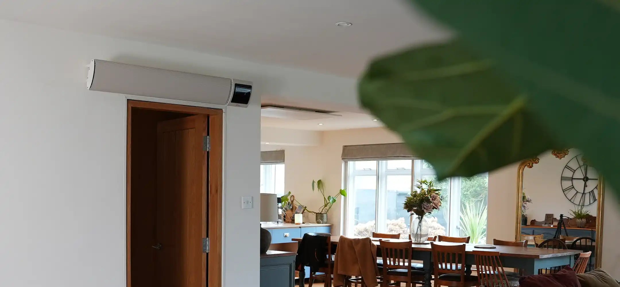 KIASA IKON infrared heater bar installed above a doorway in Denmark House, providing silent, energy-efficient heating for a residential music retreat