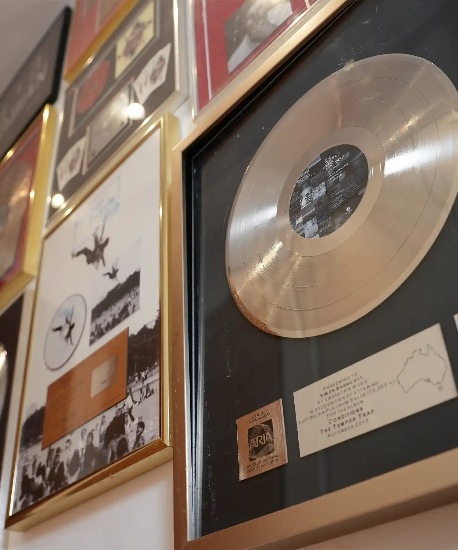 Close-up of framed gold record awards inside Bluebell Hill Studios with silent infrared heating installed