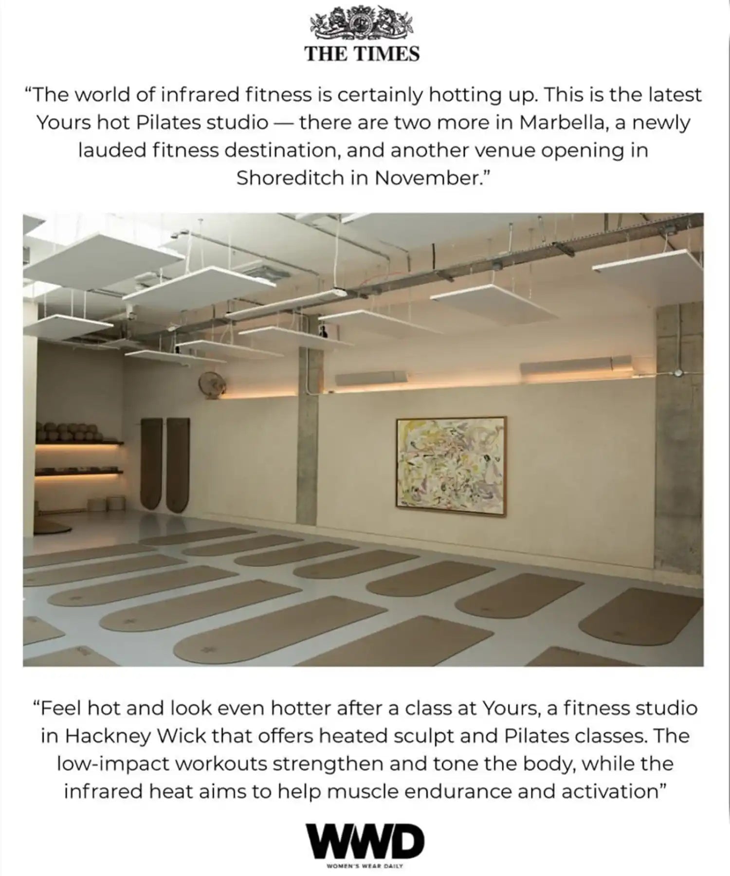 Interior of YOURS Studio London showing ceiling-mounted infrared heating panels above the workout area, red accent-lighting and minimalist barres.