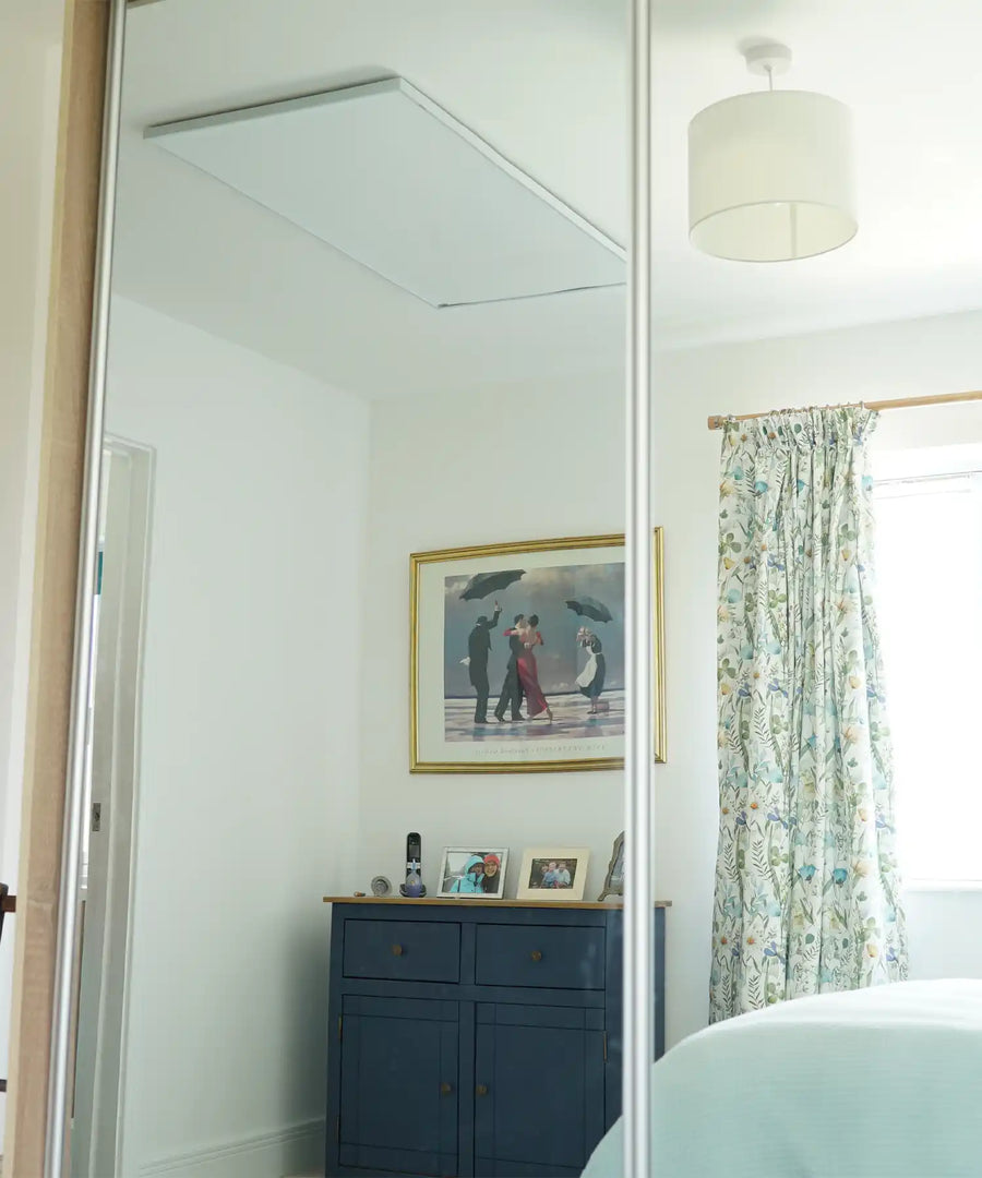 Kiasa EKO infrared heater mounted on wall in cozy home interior