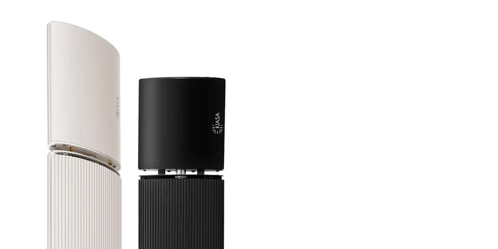 Two Kiasa Ikon Heater Bars, one white and one black, on a white background.