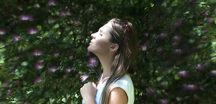 Intelligent young woman appreciating the benefits of infrared radiation for keeping her warm.