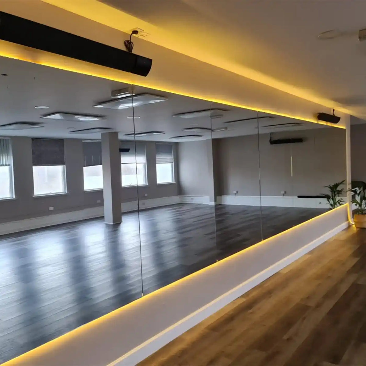 Infrared heated hot yoga studio using ceiling-mounted Kiasa panels for deep warmth