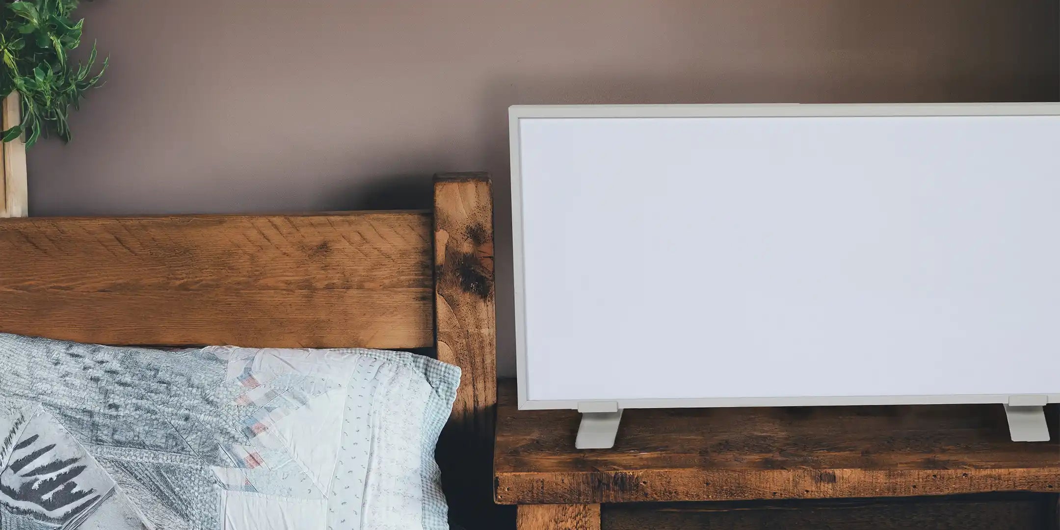 Portable panel heater on bedside table