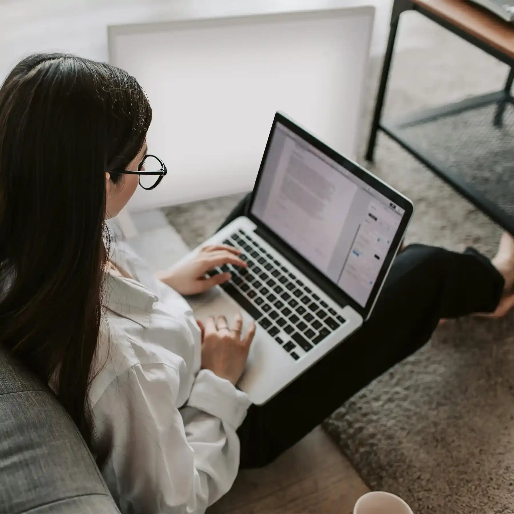 Woman working from home using 350w infrared Panel as a portable heater 
