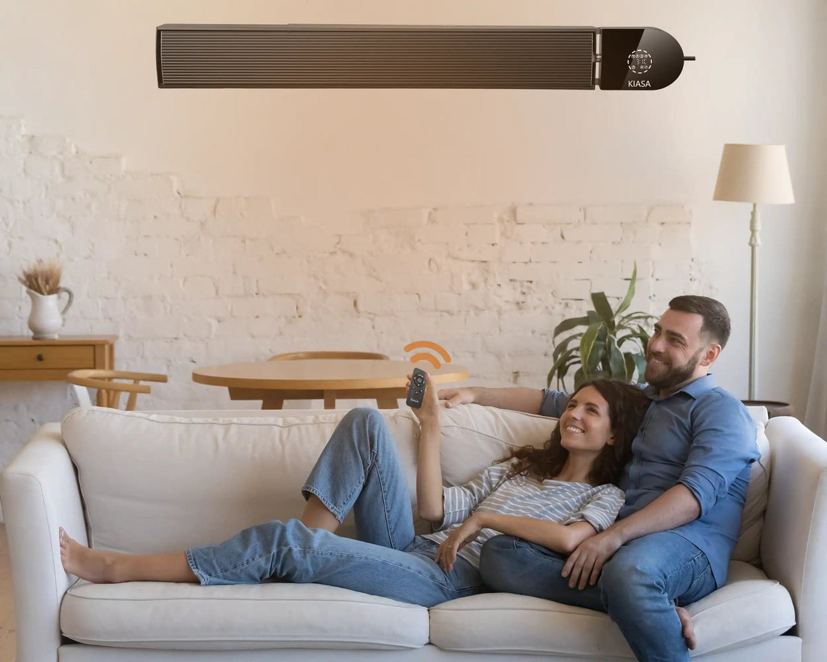 KIASA 1800W Smart Wi-fi Infrared heater bar wall mounted on the wall in a living room - Being controlled through the remote