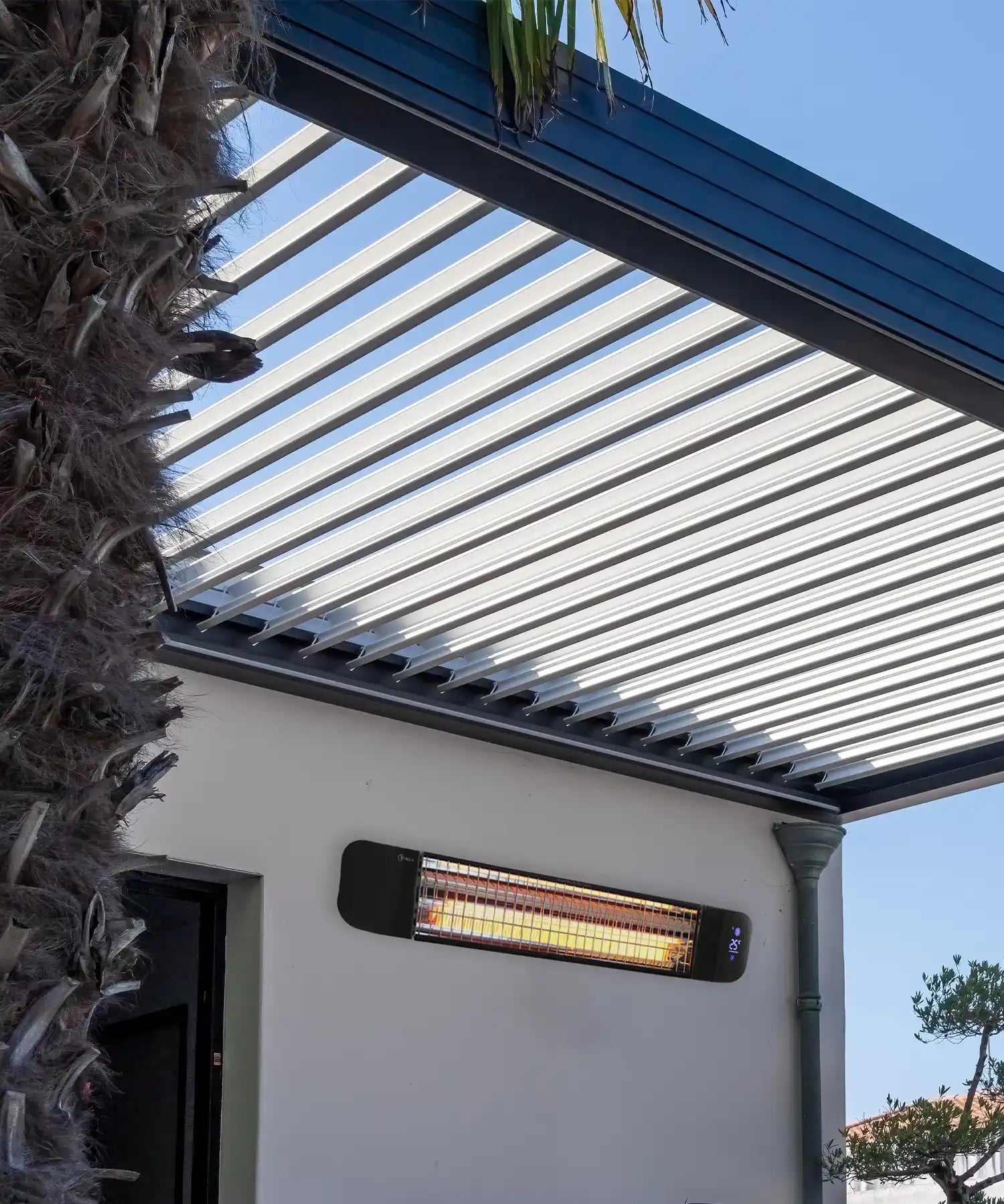 Outdoor restaurant terrace with electric infrared patio heater providing warmth for al fresco dining.