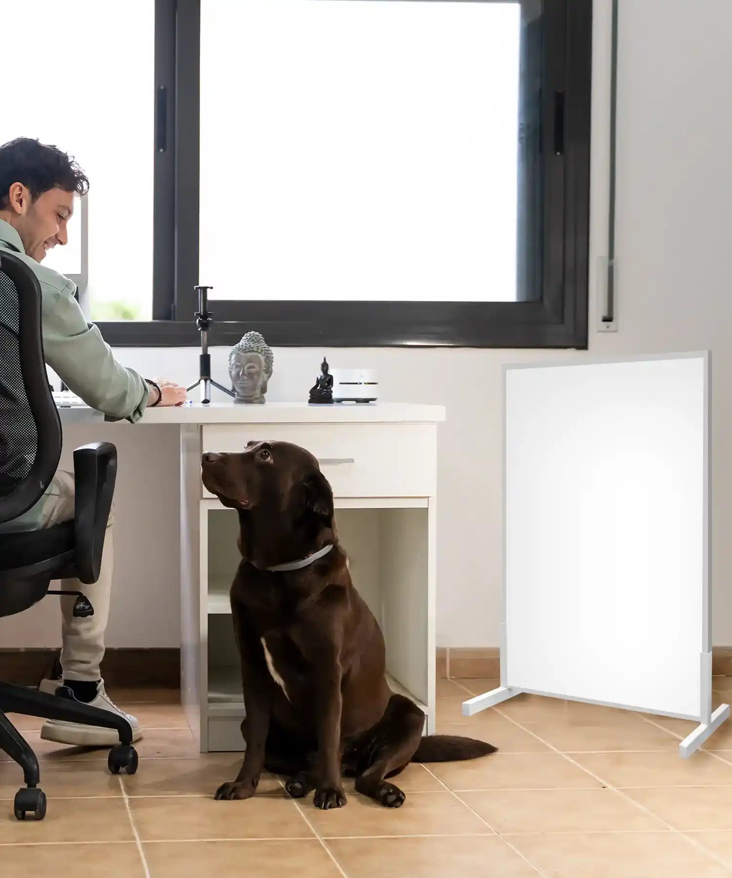 Portable infrared heating panel warming modern study or home office workspace.